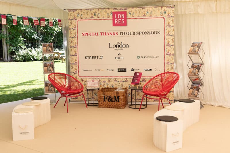 The sponsor lounge and sponsor wall in the marquee at the LonRes Summer Party
